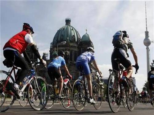 In this file photo participants ride their bicycles past the German cathedral (L) and the television tower (R) during a Velothon street race in Berlin May 25, 2008. A Berlin brothel has come up with a novel way to negate the impact of the global economic crisis and target a new group of customers at the same time -- offering a discount to patrons who arrive on bicycles. REUTERS/Fabrizio Bensch