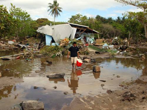 Tsunamis swept across the Pacific island nations of Samoa, American Samoa and Tonga, leaving at least 140 dead. (Getty Images)