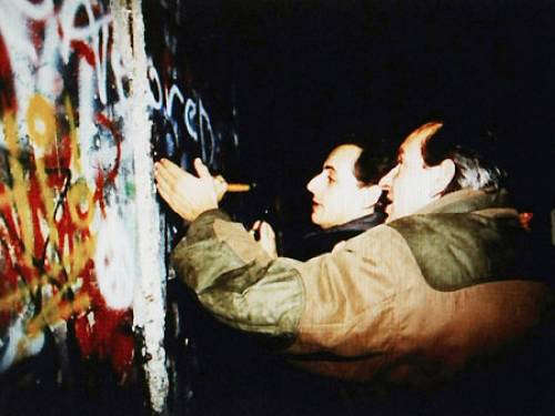 Nicolas Sarkozy posted a photograph of himself chipping away at the Berlin Wall in 1989 on his Facebook page (Getty)