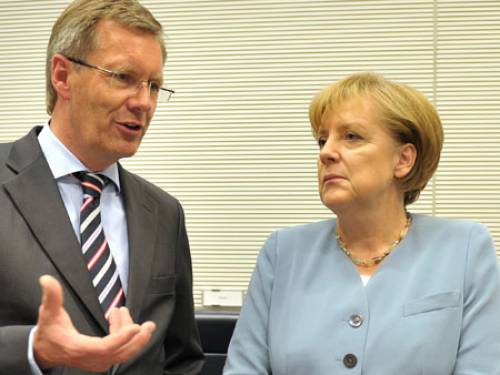 Christian Wulff with Chancellor Angela Merkel. (Getty)