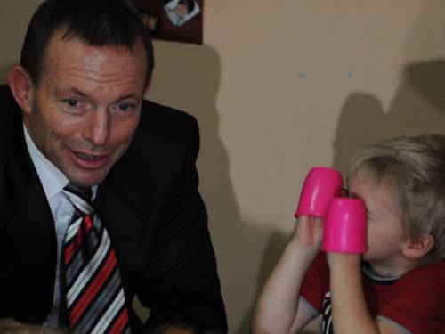 Coalition leader Tony Abbott meets a less-than-impressed child on the campaign trail (AAO)