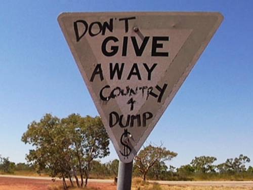 Opposition to the dump can be seen near the entrance of the land in question. (Bill Code)