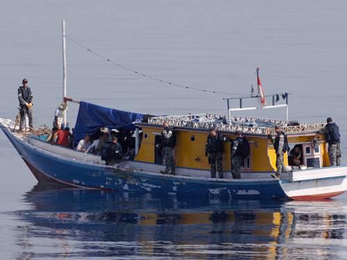 The government is attempting to get a deal through parliament which would see boat arrivals sent to Malaysia. (AAP) 