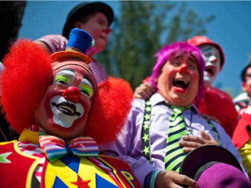 The clowns chuckled for 15 minutes on the premise that a world with more laughter will have less time or appetite for violence. (Getty)