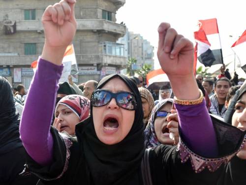 Two people were killed in dawn fighting in Cairo's administrative heart as security forces swooped to remove the protesters. (Getty)