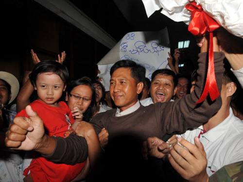 Myanmar political prisoner Kyaw Min Yu and his family celebrate following their release from detention. (Getty)