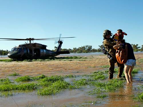 The ADF has tasked four Black Hawk, four Kiowa helicopters and a C-130 Hercules aircraft to assist people affected by floods in Roma, St George and Dirranbandi, SE Queensland. (AAP)