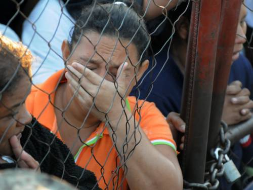 Families grieve the inmates killed in an inferno that broke out at Comayagua jail in Honduras. (Getty)