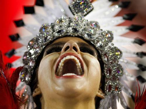 A dancer from the Mangueira samba school performs during the carnival celebrations at the Sambadrome in Rio de Janeiro, Brazil, Tuesday, 21 February, 2012. (AAP)