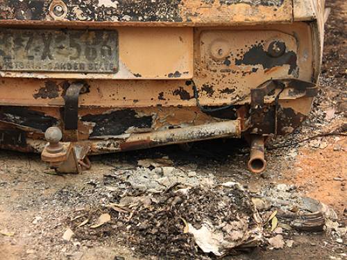 A car lies in ruins after the deadly bushfires in Victoria (Bryony Jones - SBS)