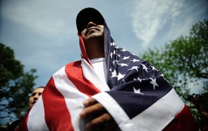 Hundreds of people rallied outside the White House demanding immigration reform in the wake of the Arizona laws. (AP)