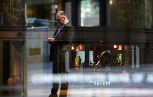 A man stops outside the Commonwealth Bank in Sydney's CBD. (AAP)