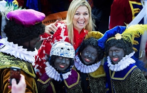 Princess Maxima poses with zwarte Pieten (Black Petes) during the arrival of Sinterklaas, or Santas Claus. (AAP)