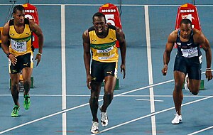 Jamaica's Usain Bolt, center, reacts at his false start. (AP)