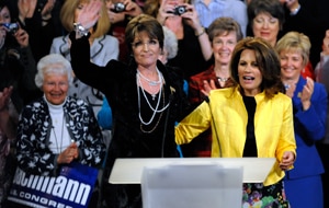 Sarah Palin, left, waves to the rally crowd after a campaign appearance for Rep. Michele Bachmann, R-Minn. in Minneapolis. (File: AP)