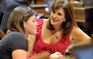 Democratic rep Lisa Brown (right) talks with a staffer after telling reporters she was banned from speaking over comments about her vagina (AP)