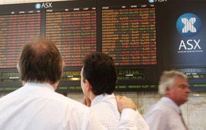 The Aussie dollar was boosted by news of a merger between the ASX and Singapore Exchange but will that be enough to stave off an interest rate rise by the RBA next week?(AAP)