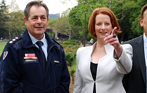 Prime Minister Julia Gillard with Australian Urban Search and Rescue team leader Rob McNeil in downtown Tokyo. (AAP)