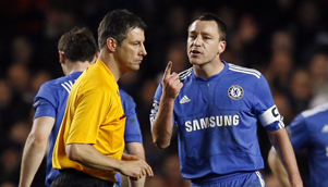 Chelsea captain John Terry threatens to run referee Wolfgang Stark down in the car park. Sort of. [GETTY]