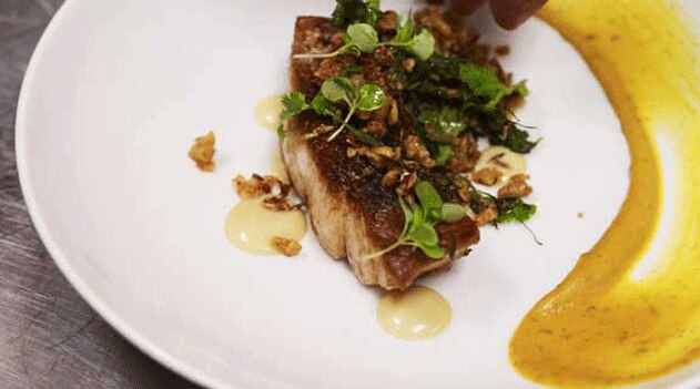 Barramundi with crunchy chickpeas and prawns, and halva mayonnaise